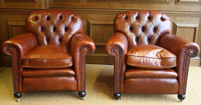 Buttoned Back Antique Pair of Leather Club Chairs